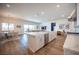 Bright, open kitchen with a large island and seamless flow to living and dining areas at 11248 Rebel Dome Ct, Las Vegas, NV 89141