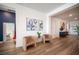 Cozy living area featuring hardwood floors, art, and seating at 11248 Rebel Dome Ct, Las Vegas, NV 89141