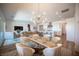 Open-concept living and dining area featuring modern lighting and stylish furnishings at 11248 Rebel Dome Ct, Las Vegas, NV 89141