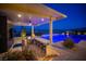 Outdoor kitchen with grill, bar seating and a view at 11248 Rebel Dome Ct, Las Vegas, NV 89141