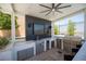 A fully equipped outdoor kitchen with stainless steel appliances, a sink, and a built-in grill under a covered patio at 11248 Rebel Dome Ct, Las Vegas, NV 89141
