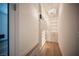 A spacious walk-in closet with shelving and drawers, illuminated by modern chandelier lighting at 11248 Rebel Dome Ct, Las Vegas, NV 89141
