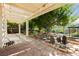Lush backyard oasis with a covered patio and serene garden area at 1311 Rolling Sunset St, Henderson, NV 89052