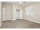 Standard bedroom with carpet, fan, closet, and window at 1311 Rolling Sunset St, Henderson, NV 89052