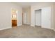 Bedroom with carpet flooring, ceiling fan, closet, and ensuite bath at 1311 Rolling Sunset St, Henderson, NV 89052