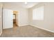 Neutral bedroom featuring carpet, a ceiling fan, and a window with blinds creating a bright space at 1311 Rolling Sunset St, Henderson, NV 89052