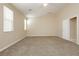 Neutral bedroom featuring carpet, and a window with blinds creating an airy space at 1311 Rolling Sunset St, Henderson, NV 89052