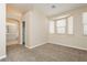 Neutral bedroom featuring carpet, and a bay window with blinds creating a comfortable space at 1311 Rolling Sunset St, Henderson, NV 89052
