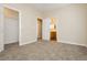 Neutral bedroom featuring carpet, an open closet, and a bathroom, promoting a relaxing atmosphere at 1311 Rolling Sunset St, Henderson, NV 89052