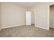 Another bedroom with a closet, fan, standard carpet, and attached room at 1311 Rolling Sunset St, Henderson, NV 89052