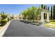 Elegant entry gate with mature trees and landscaping, a serene welcome to the community at 1311 Rolling Sunset St, Henderson, NV 89052