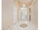 Elegant foyer featuring tile flooring, high ceilings, and ornate glass front doors at 1311 Rolling Sunset St, Henderson, NV 89052