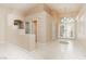 Bright foyer with soaring ceilings, tile flooring, and decorative front doors at 1311 Rolling Sunset St, Henderson, NV 89052