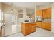 Bright kitchen featuring a center island, stainless steel appliances, and tile flooring at 1311 Rolling Sunset St, Henderson, NV 89052