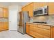 Kitchen features granite countertops, stainless steel appliances, and light wood cabinets at 1311 Rolling Sunset St, Henderson, NV 89052