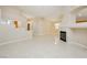 Spacious living room with tile flooring and a cozy fireplace feature at 1311 Rolling Sunset St, Henderson, NV 89052