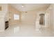 Bright and airy living area featuring tile floors and a fireplace at 1311 Rolling Sunset St, Henderson, NV 89052