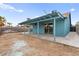 Cozy backyard with a covered patio, ideal for enjoying the outdoors and entertaining guests at 1405 Wintergreen Dr, Las Vegas, NV 89128