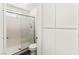Bathroom with a white tiled shower, toilet, and built in shelving units at 1405 Wintergreen Dr, Las Vegas, NV 89128