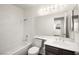 Bathroom with a tub and shower combination and a large mirror at 1405 Wintergreen Dr, Las Vegas, NV 89128
