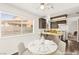 Bright dining room adjacent to the kitchen, with a table for four at 1405 Wintergreen Dr, Las Vegas, NV 89128