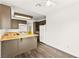 Kitchen with laminate floor, wood cabinets and countertops and white appliances at 1405 Wintergreen Dr, Las Vegas, NV 89128