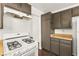 Galley kitchen with butcher block countertops and white appliances at 1405 Wintergreen Dr, Las Vegas, NV 89128