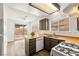Functional kitchen with wooden countertops, white appliances, and sliding glass door to the backyard at 1405 Wintergreen Dr, Las Vegas, NV 89128