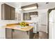 Eat-in kitchen featuring wood countertops, a gas range, and wood-stained cabinets at 1405 Wintergreen Dr, Las Vegas, NV 89128