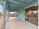 Covered patio with blue painted beams and view of the fenced in backyard at 1405 Wintergreen Dr, Las Vegas, NV 89128