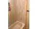 Bathroom with a bathtub and tiled shower featuring horizontal, white and tan tile at 1512 Couples St, Las Vegas, NV 89128
