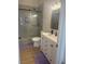 Modern bathroom with a double sink vanity and glass-enclosed shower at 1512 Couples St, Las Vegas, NV 89128