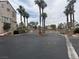 Gated community entrance with palm trees offering security and exclusivity at 1512 Couples St, Las Vegas, NV 89128