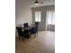 Dining area with sleek furniture and natural light from large windows at 1512 Couples St, Las Vegas, NV 89128