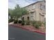 Multi-story home with desert landscaping featuring rock and native vegetation at 1512 Couples St, Las Vegas, NV 89128