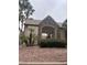 A community pool area featuring desert landscaping with rocks and palm trees at 1512 Couples St, Las Vegas, NV 89128