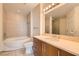 Elegant bathroom with double sink vanity, soaking tub, and tile flooring at 200 W Sahara Ave # 1102, Las Vegas, NV 89102