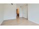 Well-lit bedroom features light wood floors and entry to an en-suite bathroom at 200 W Sahara Ave # 1102, Las Vegas, NV 89102