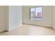 Spacious bedroom with light wood floors and a window offering city views at 200 W Sahara Ave # 1102, Las Vegas, NV 89102