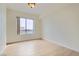 Bright bedroom features light wood floors and a large window with city views at 200 W Sahara Ave # 1102, Las Vegas, NV 89102