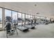 Well-equipped fitness center with treadmills, elliptical machines, and large windows with city views at 200 W Sahara Ave # 1102, Las Vegas, NV 89102
