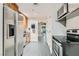 Kitchen featuring stainless steel appliances, modern countertops, and tiled flooring at 200 W Sahara Ave # 1102, Las Vegas, NV 89102