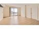 Living room with modern flooring, neutral walls, city views, and a sliding glass door at 200 W Sahara Ave # 1102, Las Vegas, NV 89102