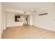 Open-concept living room boasts wood flooring, recessed lighting, and a modern, minimalist design at 200 W Sahara Ave # 1102, Las Vegas, NV 89102