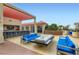 Outdoor lounge area with comfortable seating, a bar, and a fire pit at 200 W Sahara Ave # 1102, Las Vegas, NV 89102