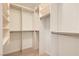Organized walk-in closet with custom shelving and ample storage space at 200 W Sahara Ave # 1102, Las Vegas, NV 89102