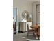 Chic dining area with a round table, stylish chairs, designer mirror, and sophisticated lighting fixture at 2000 Fashion Show Dr # 6109, Las Vegas, NV 89109