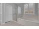Bathroom with a soaking tub, glass-enclosed shower, and natural light through shuttered windows at 2144 Mountain City St, Henderson, NV 89052