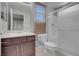 Bathroom featuring a glass shower, modern vanity, window, and neutral colors at 2144 Mountain City St, Henderson, NV 89052