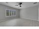 Sunlit bedroom with modern flooring, ceiling fan, and shuttered windows, creating a bright atmosphere at 2144 Mountain City St, Henderson, NV 89052
